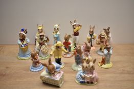 A collection of sixteen Royal Doulton bone china Bunnykins Series figures including characters '