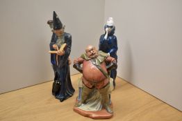 A group of three Royal Doulton figurines comprising 'Falstaff' HN 2054, 'The Wizard' HN 2877 in matt
