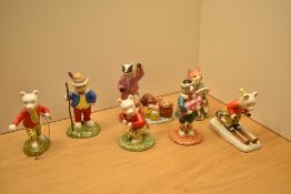 Five Royal Doulton Rupert Bear figurines comprising 'Rupert Takes A Skiing Lesson' RB 20, 'Rupert