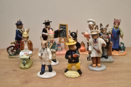 A group of eleven bone china Royal Doulton Bunnykins Series figures including characters '