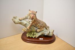 A Renaissance fine English bone china limited edition study of a Jaguar mounted on wooden log.