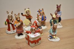 A group of nine Royal Doulton bone china Bunnykins Series figures including characters 'Christmas