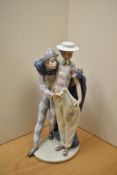 A Lladro porcelain figure group 'Carnival Companions' number 6195, stands at 31cm tall.