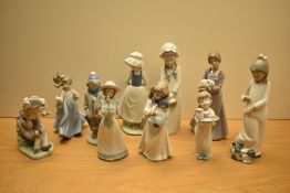 An assortment of Lladro and Nao by Lladro porcelain figures comprising 'Please Please' number