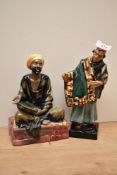 Two Royal Doulton bone china figures 'Carpet Seller' HN 1464 and 'Mendicant' HN 1365.