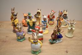 A collection of fourteen Royal Doulton bone china Bunnykins Series figures including characters '