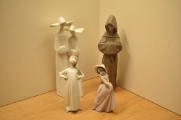 A group of four Lladro porcelain figures comprising 'Two Sisters in White' number 4611, 'Monk'