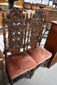 A pair of nice quality oak 19th Century Carolean style hall chairs having upholstered seats