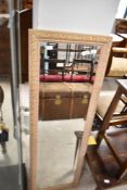 A modern full length wall mirror, approx. 119 x 39cm