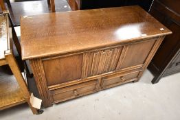 A vintage oak bedding chest having linen fold decoration to front panel, width approx. 99cm