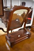 A Victorian mahogany toilet mirror of small proportions with drawer base