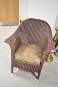 A vintage Lloyd Loom tub chair
