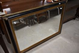 A vintage ebonised and gilt framed wall mirror, approx 79 x 108cm