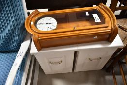 Two modern bedside cabinets and a modern wall clock