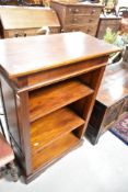 A modern hardwood bookshelf, approx dimensions W75 H110 D40cm