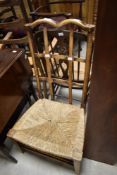 A 19th Century low rush seated nursing chair
