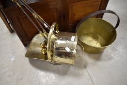 A brass jam pan , coal helmet and selection of fire tools