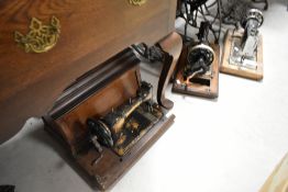 Three vintage handcrank sewing machines