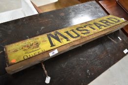 A vintage wooden Mustard sign, width approx. 67cm