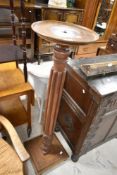 A 19th Century mahogany jardinere stand having circular top and square base