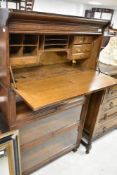 A Globe Wernicke or similar oak bookcase having three glazed tiers and bureau tier to top section (