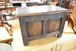 A period oak kist of small proportions having carved frame , dimensions approx. W61 D36 H41cm