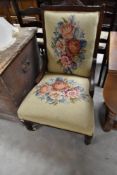 A Victorian mahogany framed nursing chair with tapestry back and seat