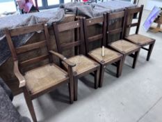 A set of five (four plus one) traditionally made oak rail back chairs having rush seats