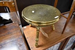 A brass stool having pierced and engraved design, diameter approx. 35cm