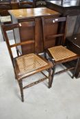 Two Victorian stained frame bedroom chairs having bergere canework seats