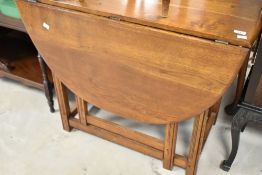 A mid to late 20th Century oak gateleg table having oval top, width approx. 91cm