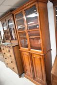 A Victorian mahogany bookcase having cupboard under, dimensions approx. W94 H222cm