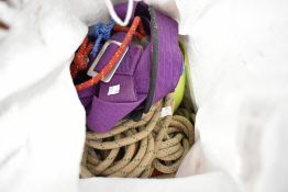 A selection of climbing ropes and harnesses etc