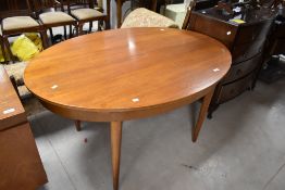 A vintage teak oval dining table, approx. 137 x 97cm