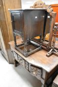 A vintage oak dressing table in the period style, and a similar bedside cupboard (some signs of