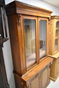 A Victorian mahogany bookcase with frieze drawer and cupboard under, approx. width 105 height 207cm