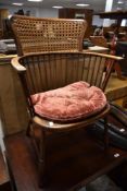 A late 19th or early 20th Century spindle armchair having turned frame, with bergere cane seat and