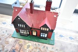 A vintage scratch built wooden dolls house