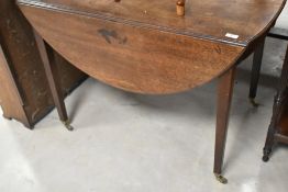 A 19th Century mahogany breakfast table in the Pembroke style, having frieze drawer and square