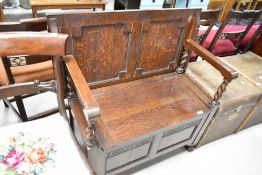 An early 20th Century oak monks bench , width approx 91cm