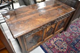 A period oak kist of nice proportions, having carved frieze and panels, width approx. 104cm