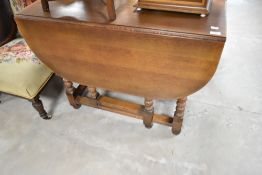 An early to mid 20th Century oak gateleg table, width approx 97cm