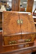 A late 19th or early 20th Century walnut stationery box , having fitted interior, width approx 42cm