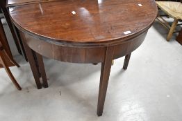A 19th Century mahogany demi lune fold over tea table, width approx. 90cm