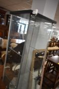 A glass display cabinet, height approx. 164cm