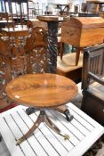 A reproduction Regency mahogany oval occasional table and a William IV style jardinere stand