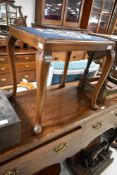 An early 20th Century mahogany framed dressing table stool having woolwork seat