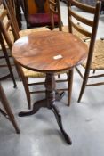 A 19th Century mahogany occasional pedestal table having circular top, turned column and triple