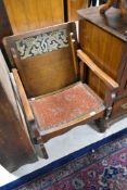 An early 20th Century oak monks chair