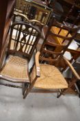 A cane seated bedroom chair and rush seated ladderback chair